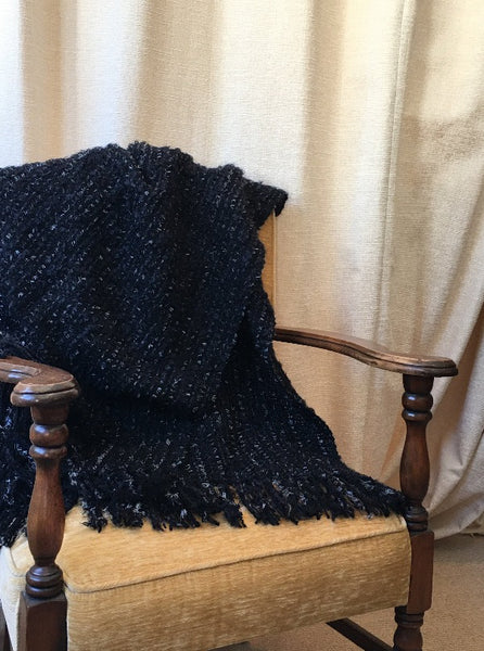 Handwoven Wrap, shown draped on a chair, like a throw